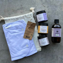 Load image into Gallery viewer, Set of skincare products and a white cloth bag on a textured gray surface